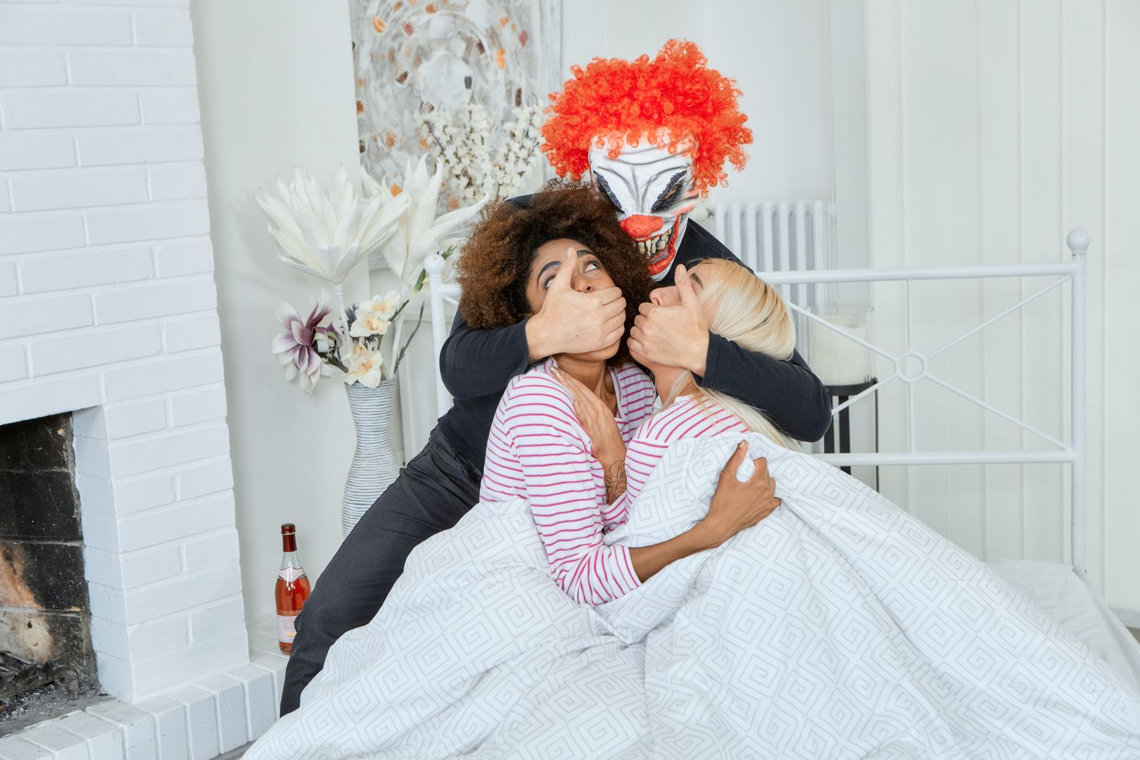 Bisexual chicks ride an evil clown