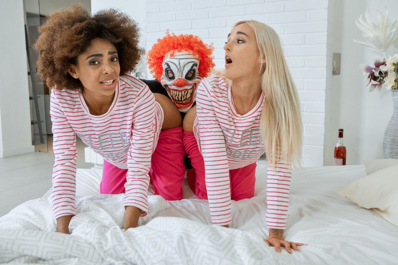Bisexual chicks ride an evil clown
