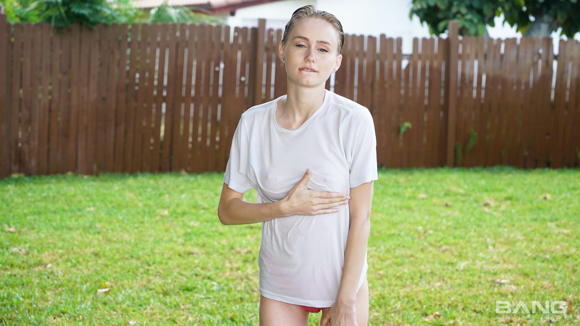 Alicia Williams Plays In The Sprinklers In A White T-Shirt