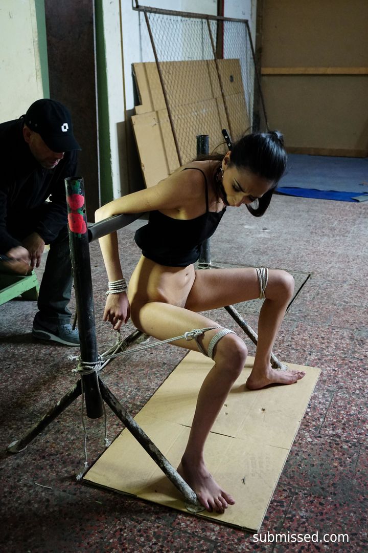 Tied up brunette loves magic wand