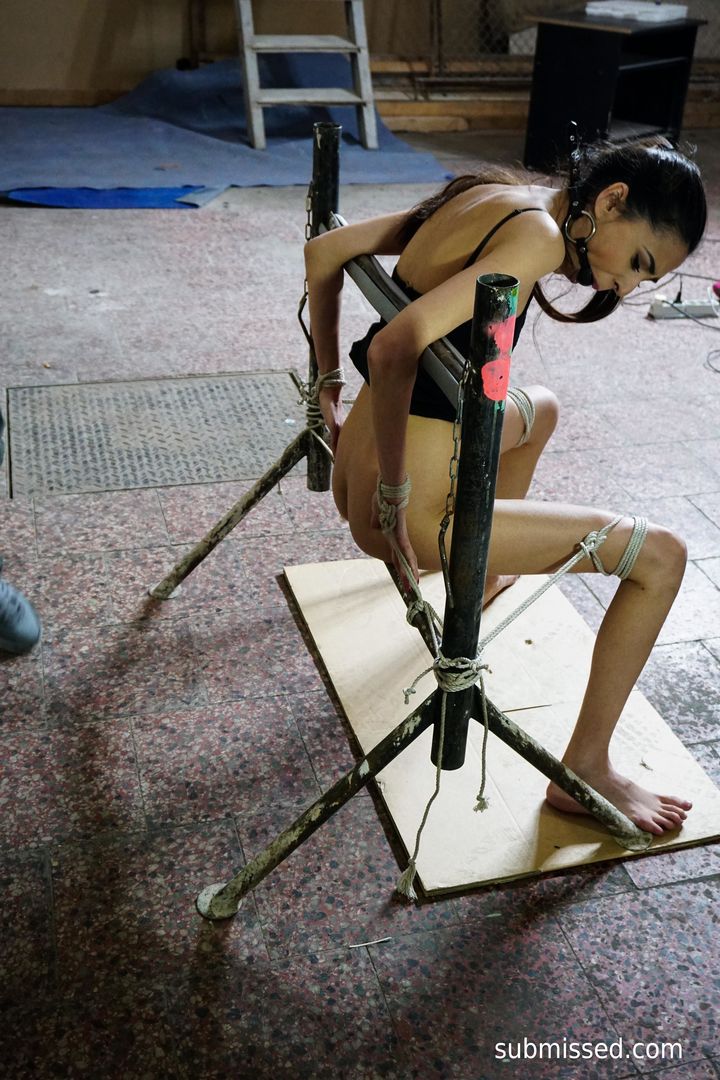 Tied up brunette loves magic wand