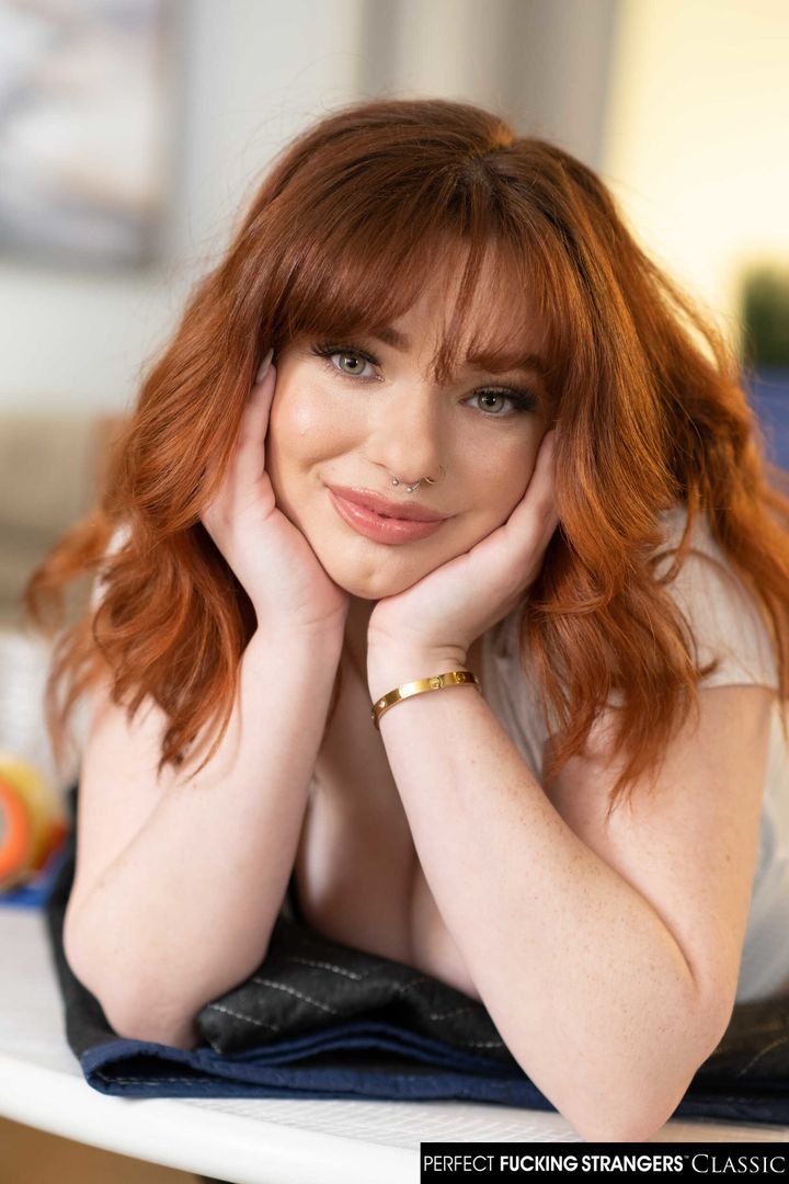Sexy red head Annabel Redd makes her big natural boobs bounce