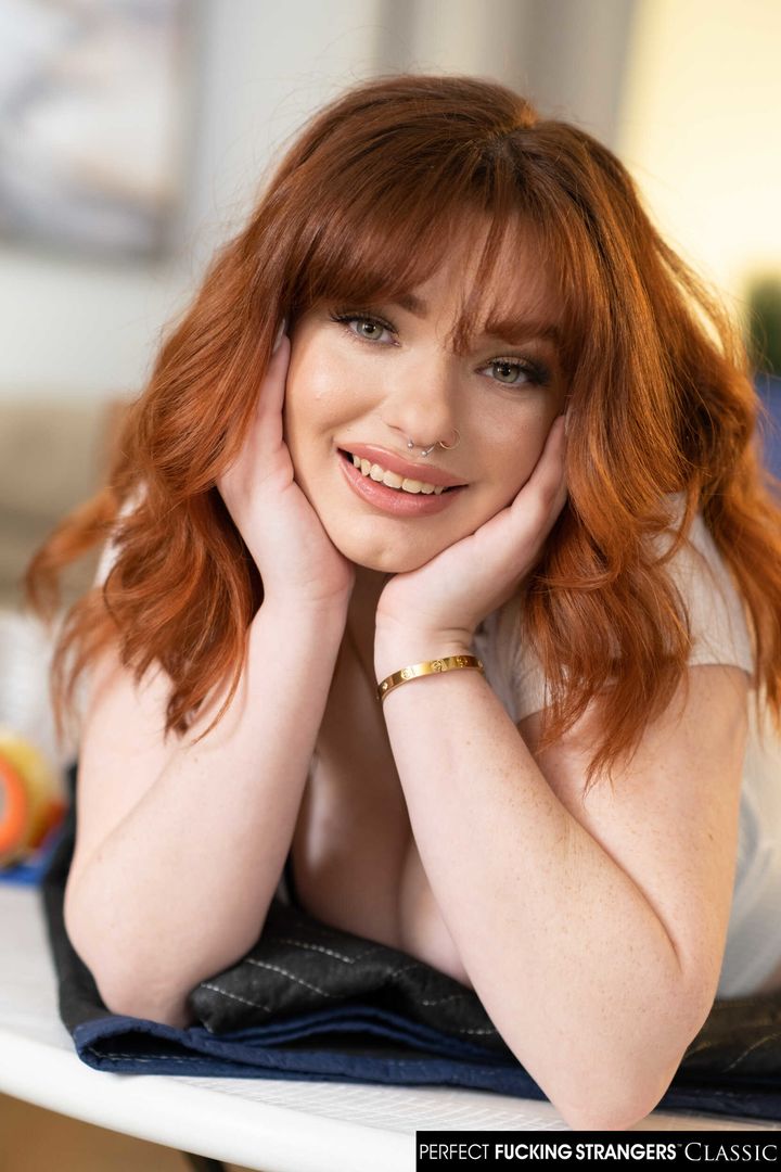 Sexy red head Annabel Redd makes her big natural boobs bounce