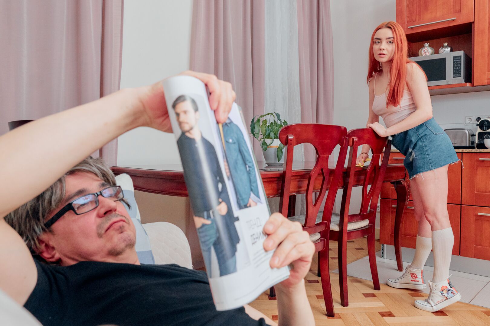 Ginger cutie seduces a grey-haired man