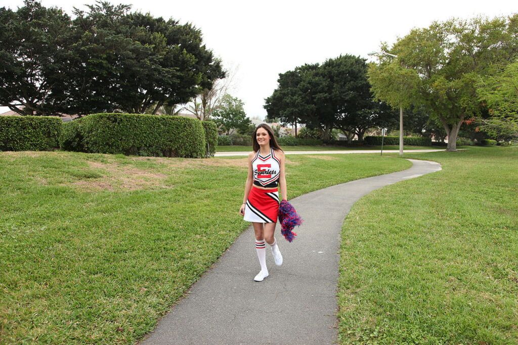 Cheerleader Monica Guides Her Pussy Onto A Stiff Cock