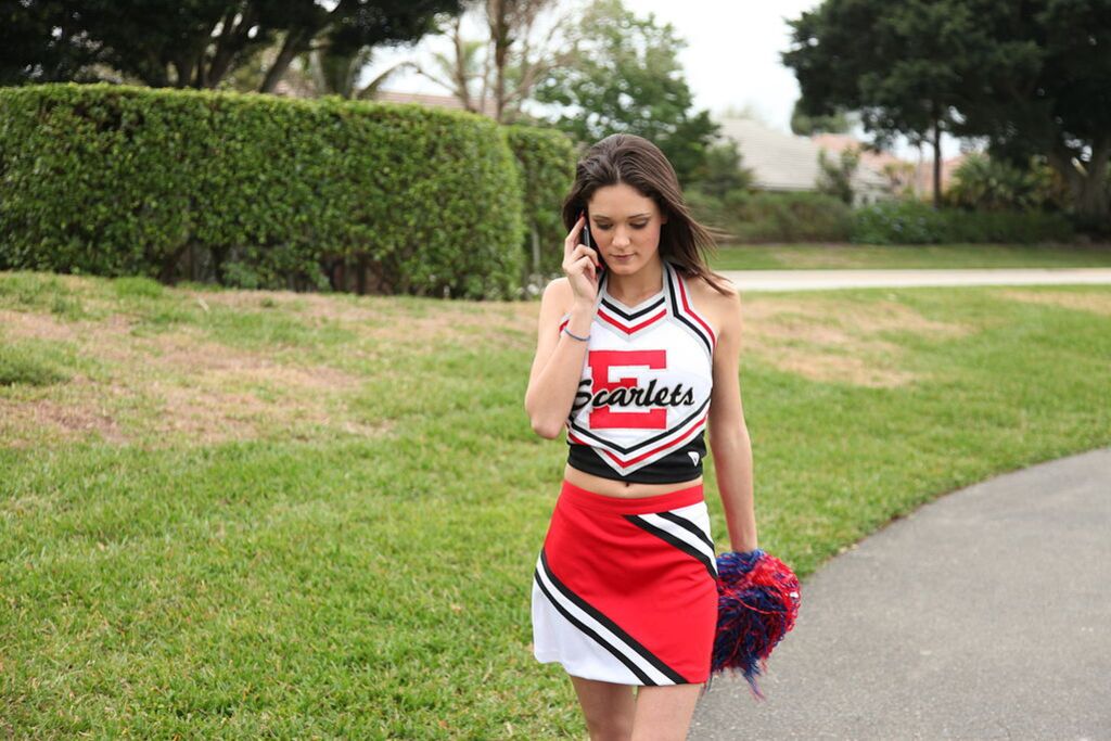 Cheerleader Monica Guides Her Pussy Onto A Stiff Cock