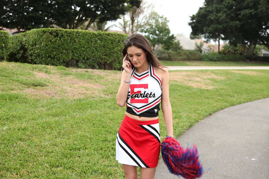 Cheerleader Monica Guides Her Pussy Onto A Stiff Cock