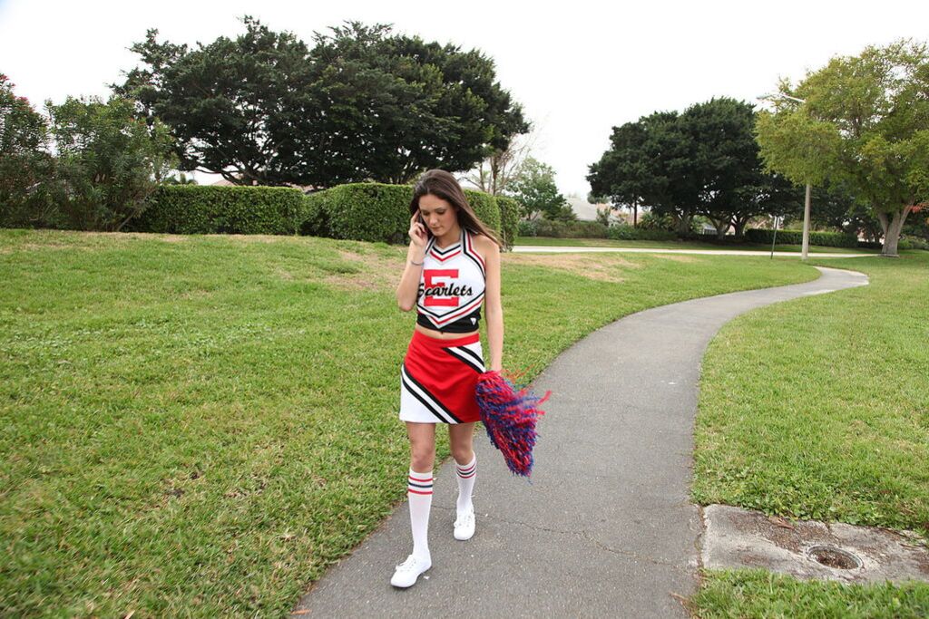 Cheerleader Monica Guides Her Pussy Onto A Stiff Cock