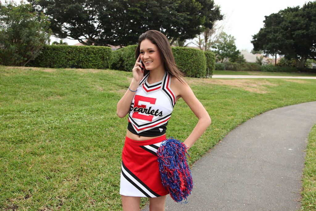 Cheerleader Monica Guides Her Pussy Onto A Stiff Cock