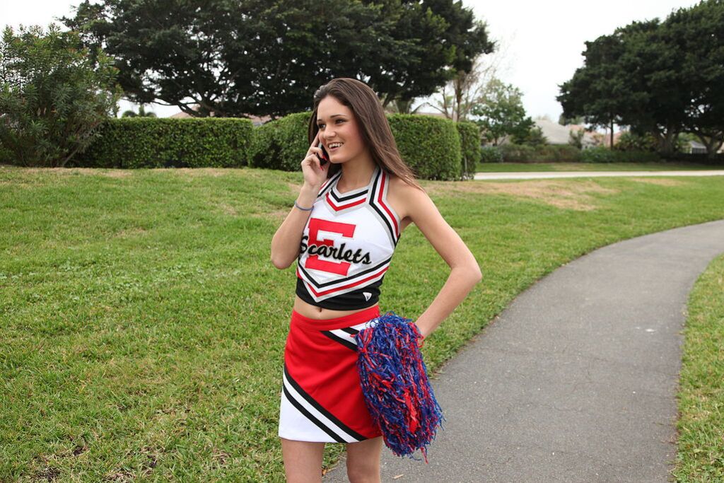 Cheerleader Monica Guides Her Pussy Onto A Stiff Cock