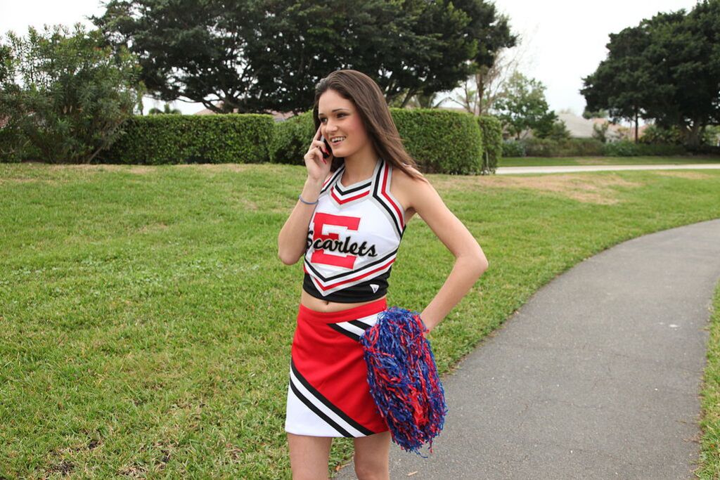 Cheerleader Monica Guides Her Pussy Onto A Stiff Cock