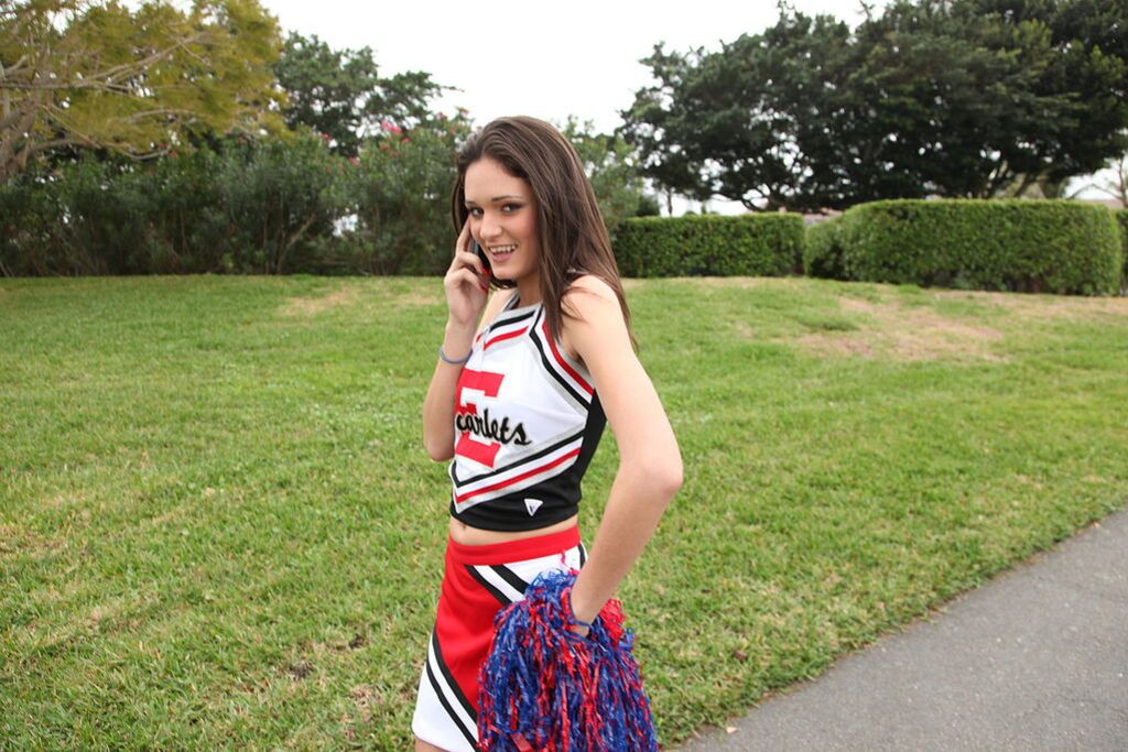 Cheerleader Monica Guides Her Pussy Onto A Stiff Cock