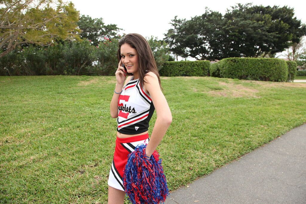 Cheerleader Monica Guides Her Pussy Onto A Stiff Cock