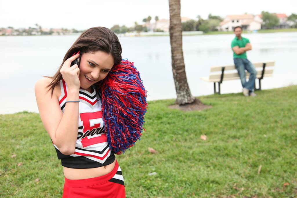 Cheerleader Monica Guides Her Pussy Onto A Stiff Cock