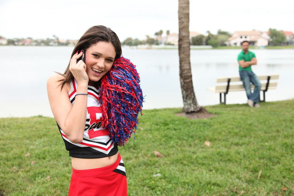 Cheerleader Monica Guides Her Pussy Onto A Stiff Cock
