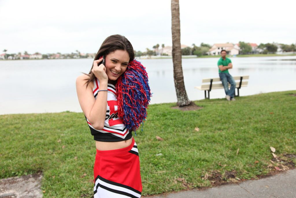 Cheerleader Monica Guides Her Pussy Onto A Stiff Cock