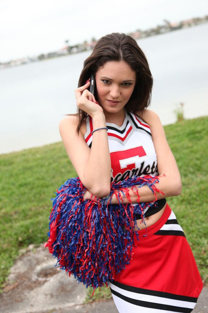 Cheerleader Monica Guides Her Pussy Onto A Stiff Cock