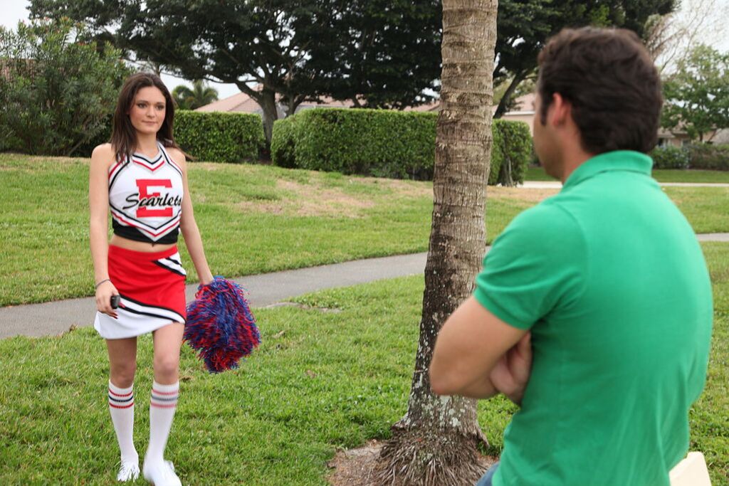 Cheerleader Monica Guides Her Pussy Onto A Stiff Cock