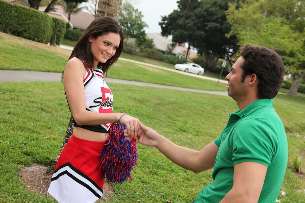 Cheerleader Monica Guides Her Pussy Onto A Stiff Cock