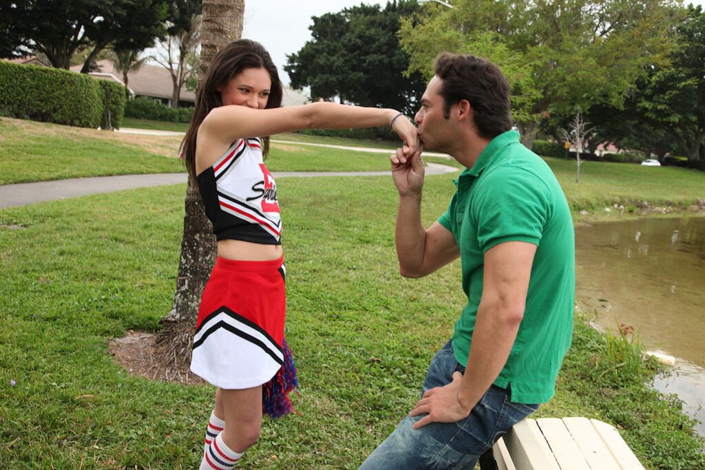 Cheerleader Monica Guides Her Pussy Onto A Stiff Cock