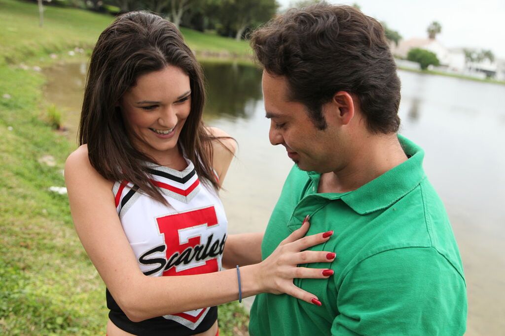 Cheerleader Monica Guides Her Pussy Onto A Stiff Cock