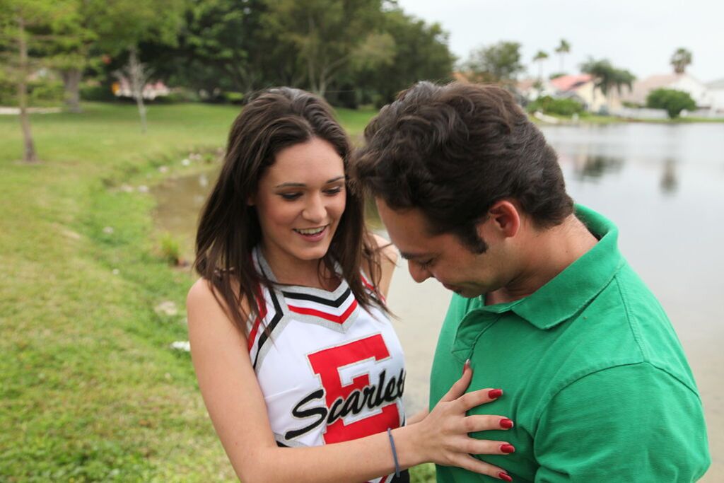 Cheerleader Monica Guides Her Pussy Onto A Stiff Cock