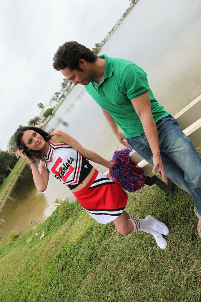 Cheerleader Monica Guides Her Pussy Onto A Stiff Cock
