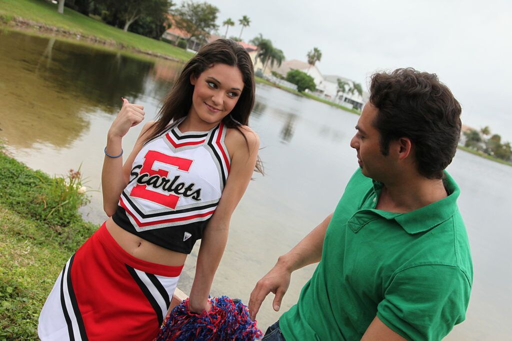 Cheerleader Monica Guides Her Pussy Onto A Stiff Cock