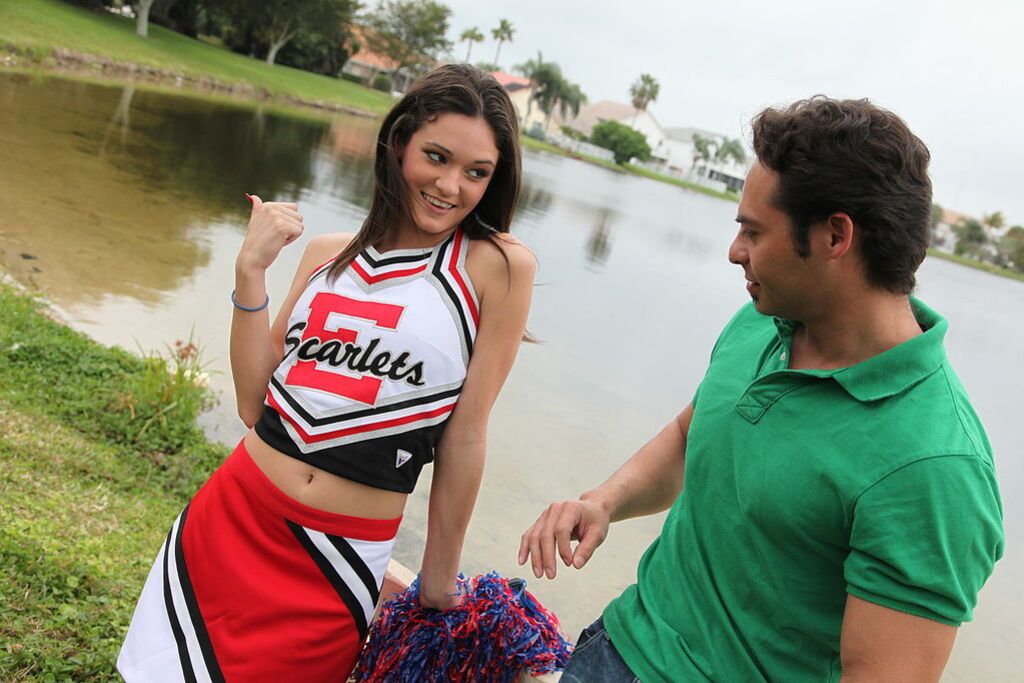 Cheerleader Monica Guides Her Pussy Onto A Stiff Cock