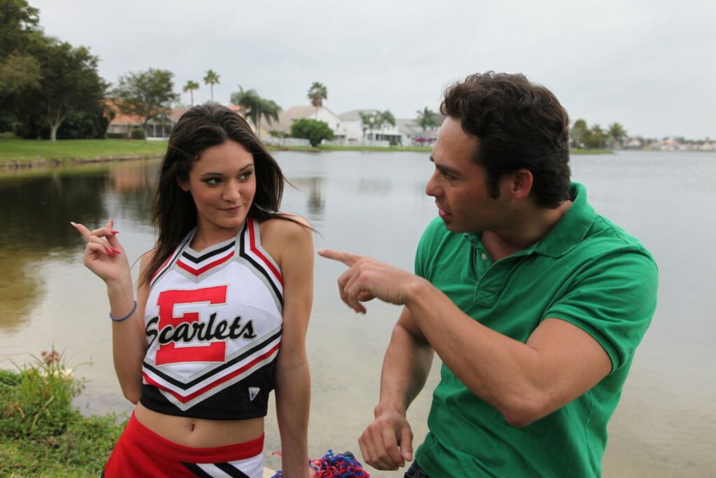 Cheerleader Monica Guides Her Pussy Onto A Stiff Cock