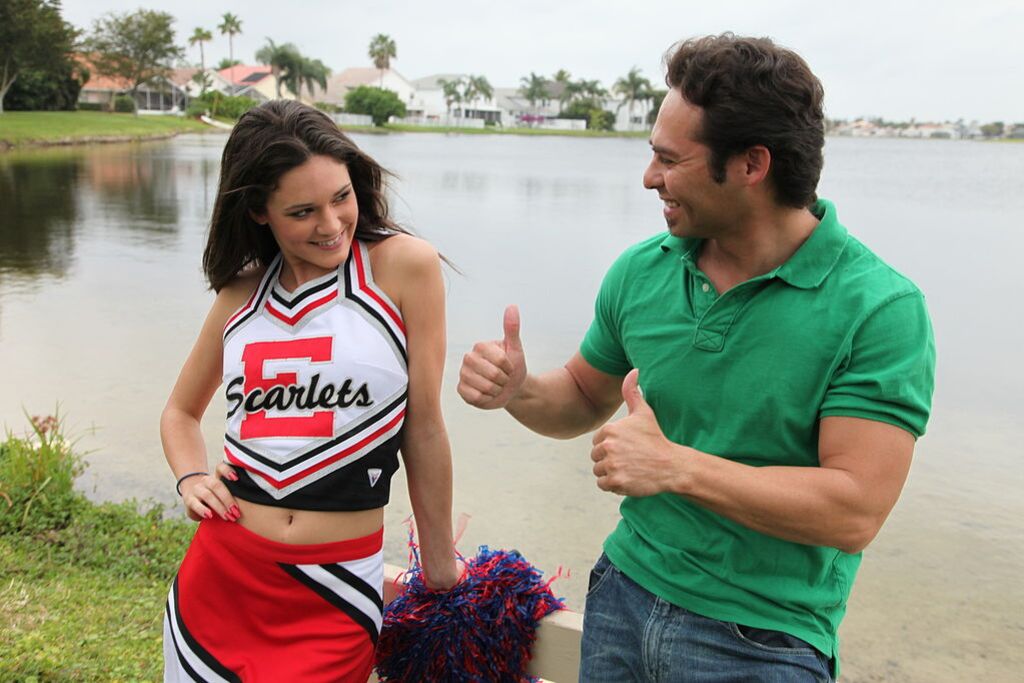 Cheerleader Monica Guides Her Pussy Onto A Stiff Cock