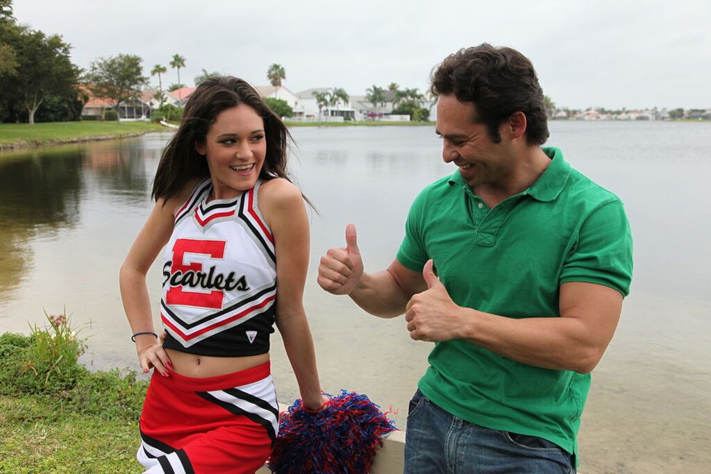 Cheerleader Monica Guides Her Pussy Onto A Stiff Cock