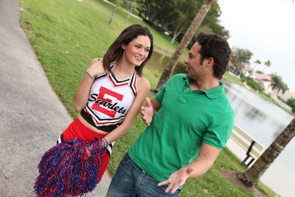 Cheerleader Monica Guides Her Pussy Onto A Stiff Cock