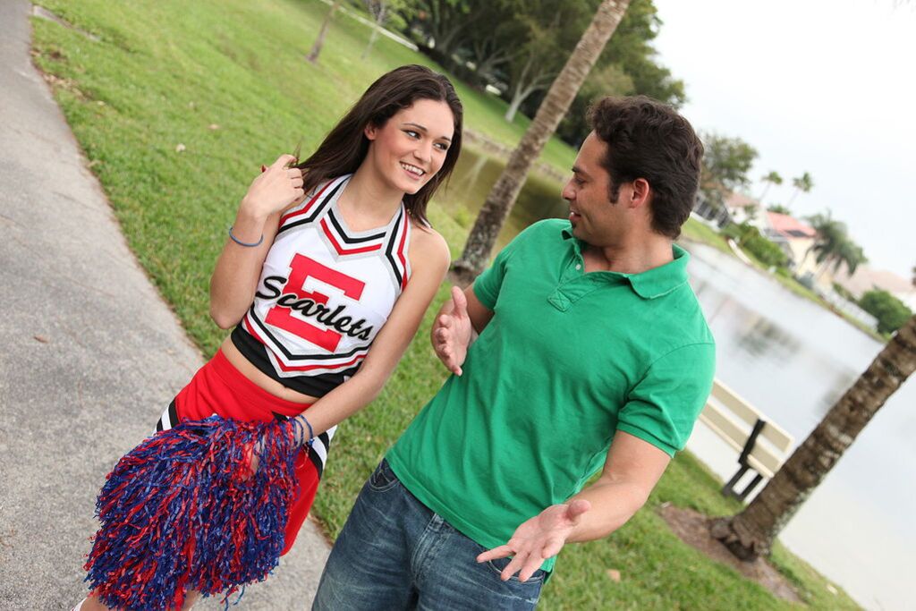 Cheerleader Monica Guides Her Pussy Onto A Stiff Cock