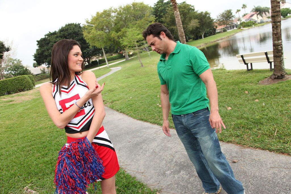Cheerleader Monica Guides Her Pussy Onto A Stiff Cock