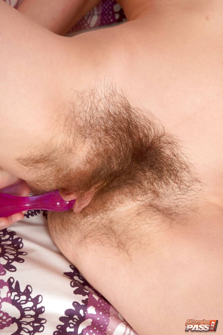 Hirsute beauty with a dildo