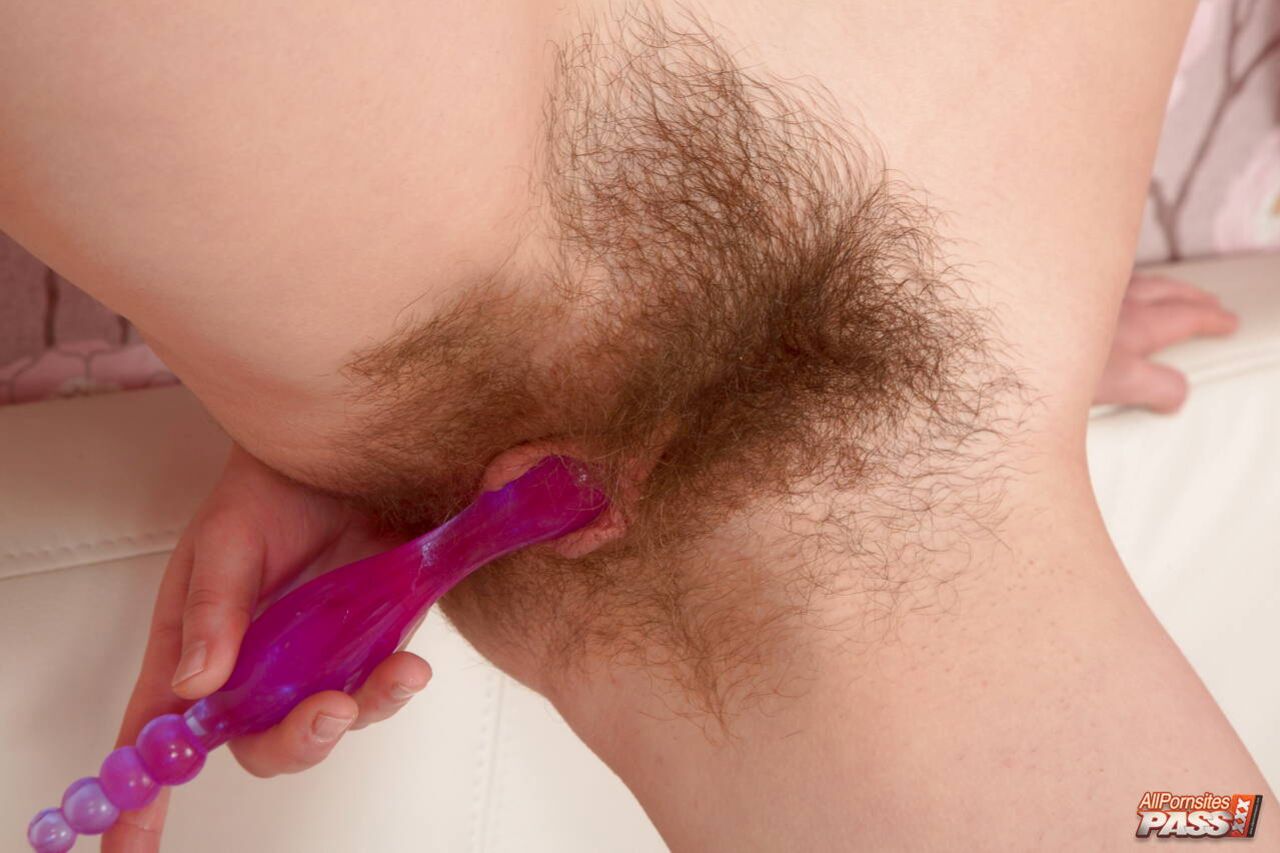 Hirsute beauty with a dildo