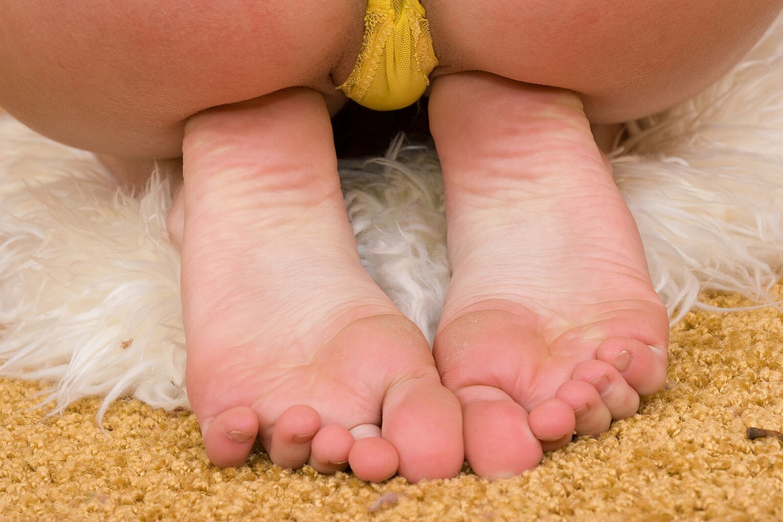 Budding Blonde Teen Gives Erotic Feet Show...