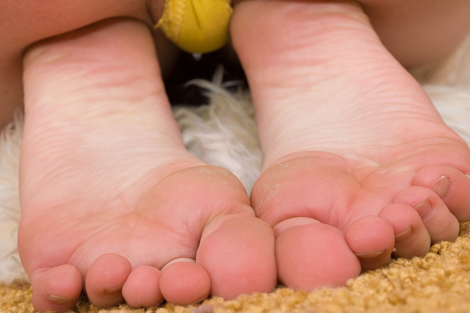 Budding Blonde Teen Gives Erotic Feet Show...
