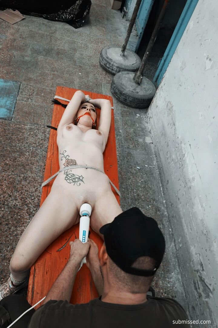Gagged busty girl plays submissive