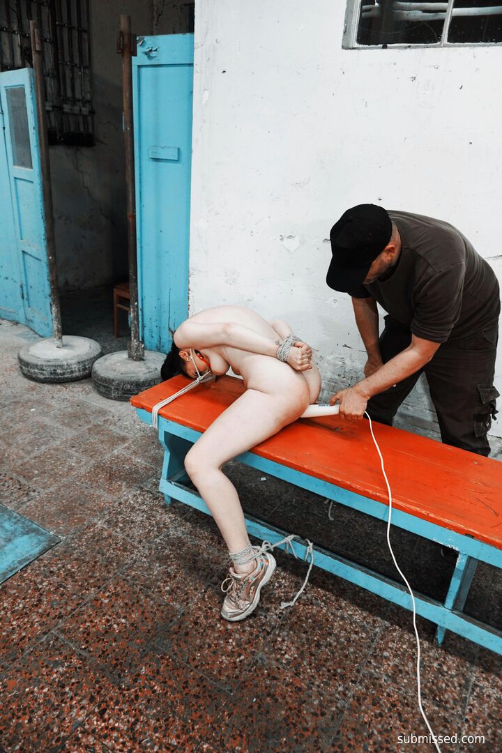 Gagged busty girl plays submissive